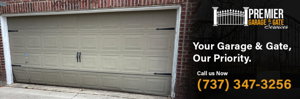 Premier Garage Gate Services technician repairing a broken garage door spring